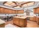 Laundry room with large island, ample cabinetry and newer appliances at 1020 E Caroline Ln, Tempe, AZ 85284