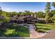 Luxury home with brick exterior and mature landscaping at 1020 E Caroline Ln, Tempe, AZ 85284