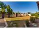 Expansive backyard with brick fence and pathways at 1020 E Caroline Ln, Tempe, AZ 85284