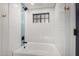 Clean bathroom with white tile and bathtub at 1020 E Caroline Ln, Tempe, AZ 85284