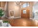 Spacious entryway with hardwood floors and chandelier at 1020 E Caroline Ln, Tempe, AZ 85284