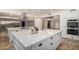 Modern kitchen with white cabinetry and stainless steel appliances at 1020 E Caroline Ln, Tempe, AZ 85284