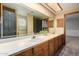 Elegant bathroom with double vanity, large mirror and updated fixtures at 1020 E Caroline Ln, Tempe, AZ 85284