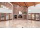 Spacious living room with brick fireplace and high ceilings at 1020 E Caroline Ln, Tempe, AZ 85284