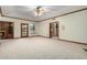 Comfortable bedroom with carpeted floors and built-in shelving at 1020 E Caroline Ln, Tempe, AZ 85284