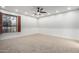 Bright bedroom with window and ceiling fan at 1020 E Caroline Ln, Tempe, AZ 85284