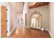 Long hallway with hardwood floors and ornate mirror at 1020 E Caroline Ln, Tempe, AZ 85284