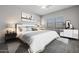 Spacious primary bedroom with large bed, nightstands, and ample natural light at 19749 S 231 St. Way, Queen Creek, AZ 85142