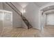 Elegant entryway with wood-look floors and a modern staircase at 19749 S 231 St. Way, Queen Creek, AZ 85142