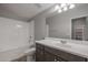 Clean bathroom with a shower/tub combo, vanity, and toilet at 19749 S 231 St. Way, Queen Creek, AZ 85142
