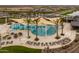 Relaxing pool area with shade sails and comfortable lounge chairs at 19749 S 231 St. Way, Queen Creek, AZ 85142