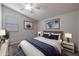 Spacious bedroom with a king-size bed, two nightstands, and artwork at 19749 S 231 St. Way, Queen Creek, AZ 85142