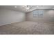 Large loft bedroom with neutral carpet and ceiling fan at 19749 S 231 St. Way, Queen Creek, AZ 85142