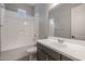 Clean bathroom with a bathtub, toilet and dark brown vanity at 19749 S 231 St. Way, Queen Creek, AZ 85142