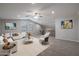 Spacious loft area furnished as a living room at 19749 S 231 St. Way, Queen Creek, AZ 85142