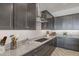 Contemporary kitchen with granite countertops, dark cabinets and stainless steel appliances at 19749 S 231 St. Way, Queen Creek, AZ 85142