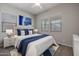 Well-lit bedroom with a king-size bed and stylish decor at 19749 S 231 St. Way, Queen Creek, AZ 85142