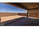 Covered patio with view of fenced backyard at 19749 S 231 St. Way, Queen Creek, AZ 85142