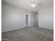 Bright bedroom with ceiling fan and neutral colored carpet at 19749 S 231 St. Way, Queen Creek, AZ 85142