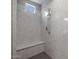 Spa-like shower with marble walls and built-in seat at 19749 S 231 St. Way, Queen Creek, AZ 85142