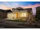 House exterior at night with landscaping and a front yard at 19749 S 231 St. Way, Queen Creek, AZ 85142