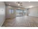 Bright living room with herringbone floors and sliding glass doors leading to the backyard at 19749 S 231 St. Way, Queen Creek, AZ 85142