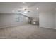 Bright loft bedroom with carpeted floor and ceiling fan at 19749 S 231 St. Way, Queen Creek, AZ 85142