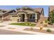 Two-story house with a front yard, driveway, and walkway at 19749 S 231 St. Way, Queen Creek, AZ 85142