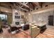 Spacious great room with stone fireplace and wood beams at 3831 E Huber St, Mesa, AZ 85205