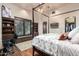 Bedroom with a four-poster bed, built-in shelves, and hardwood floors at 3831 E Huber St, Mesa, AZ 85205