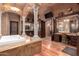 Large bathroom with soaking tub, double vanity, and separate shower at 3831 E Huber St, Mesa, AZ 85205