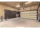 Large garage with ample storage, overhead storage, and a finished floor at 3831 E Huber St, Mesa, AZ 85205