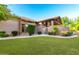Stunning Spanish-style home with manicured lawn and gated entry at 3831 E Huber St, Mesa, AZ 85205