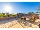 Relaxing rooftop patio with fire pit and seating area, offering scenic views at 3831 E Huber St, Mesa, AZ 85205