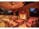Outdoor kitchen with fireplace and seating area at 3831 E Huber St, Mesa, AZ 85205