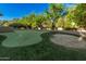 Expansive putting green nestled in the backyard at 3831 E Huber St, Mesa, AZ 85205