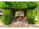 Relaxing pergola seating area covered in lush greenery at 3831 E Huber St, Mesa, AZ 85205