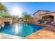 Stunning pool with rock waterfall and lounge chairs at 3831 E Huber St, Mesa, AZ 85205