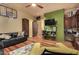 Game room with a basketball hoop, comfortable seating, and a workspace at 3831 E Huber St, Mesa, AZ 85205
