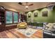 Game room with built-in shelving, comfortable seating, and dog crates at 3831 E Huber St, Mesa, AZ 85205