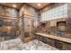 Spacious shower with multiple shower heads and stone tile at 3831 E Huber St, Mesa, AZ 85205
