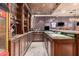 Custom-built bar with granite countertops and extensive shelving at 3831 E Huber St, Mesa, AZ 85205