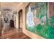 Elegant hallway with hardwood floors and a stunning painted mural at 3831 E Huber St, Mesa, AZ 85205