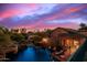 Elevated view of the pool and backyard at sunset with lounge chairs at 3831 E Huber St, Mesa, AZ 85205
