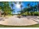 Circular courtyard with fountain and palm trees during daytime at 3831 E Huber St, Mesa, AZ 85205