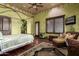 Bright bedroom with a four-poster bed and sitting area at 3831 E Huber St, Mesa, AZ 85205