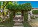 Covered pergola with seating in the backyard at 3831 E Huber St, Mesa, AZ 85205