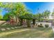 Landscaped backyard with pergola and playset at 3831 E Huber St, Mesa, AZ 85205