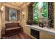 Charming sitting area with a bench and garden-themed wall art at 3831 E Huber St, Mesa, AZ 85205
