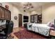 Bedroom with a bed, desk and entertainment center at 3831 E Huber St, Mesa, AZ 85205